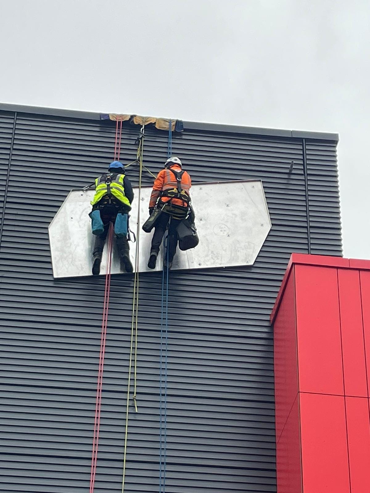 Base 71, Barnsley — lifting sign panel into position
