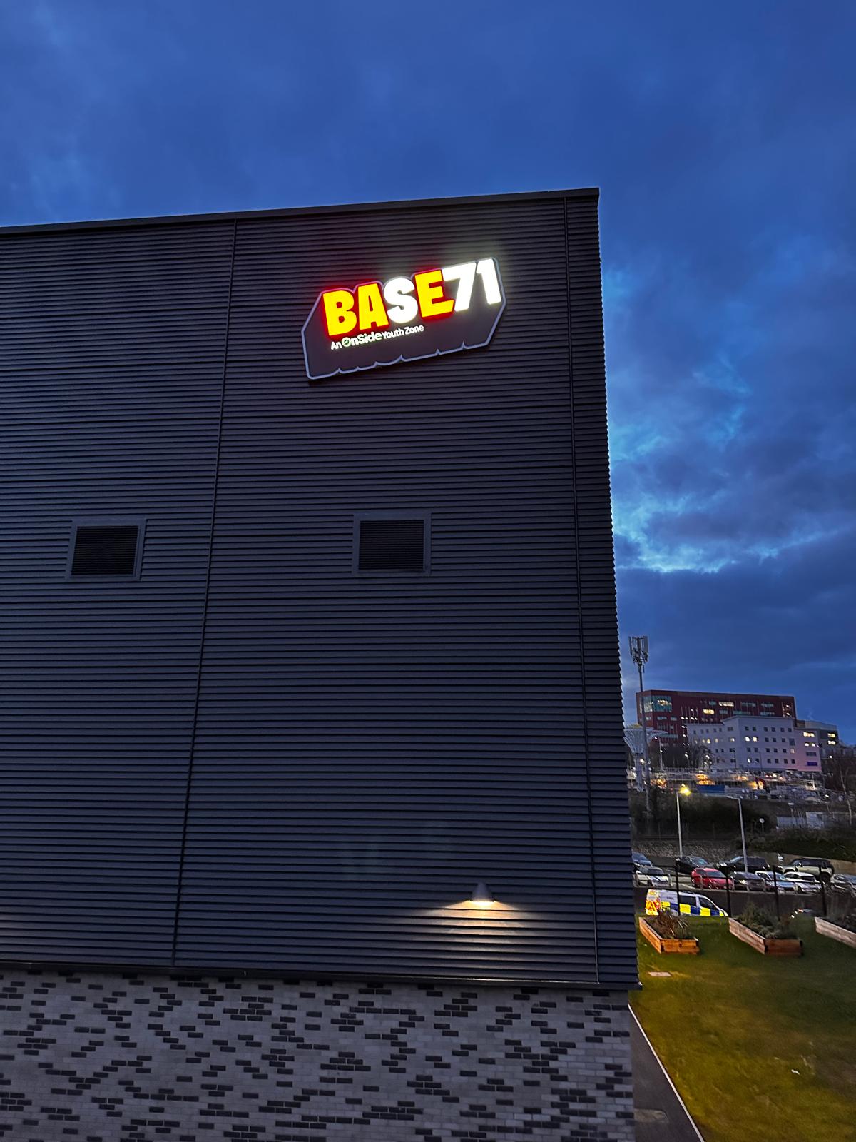 Base 71, Barnsley — illuminated sign at dusk