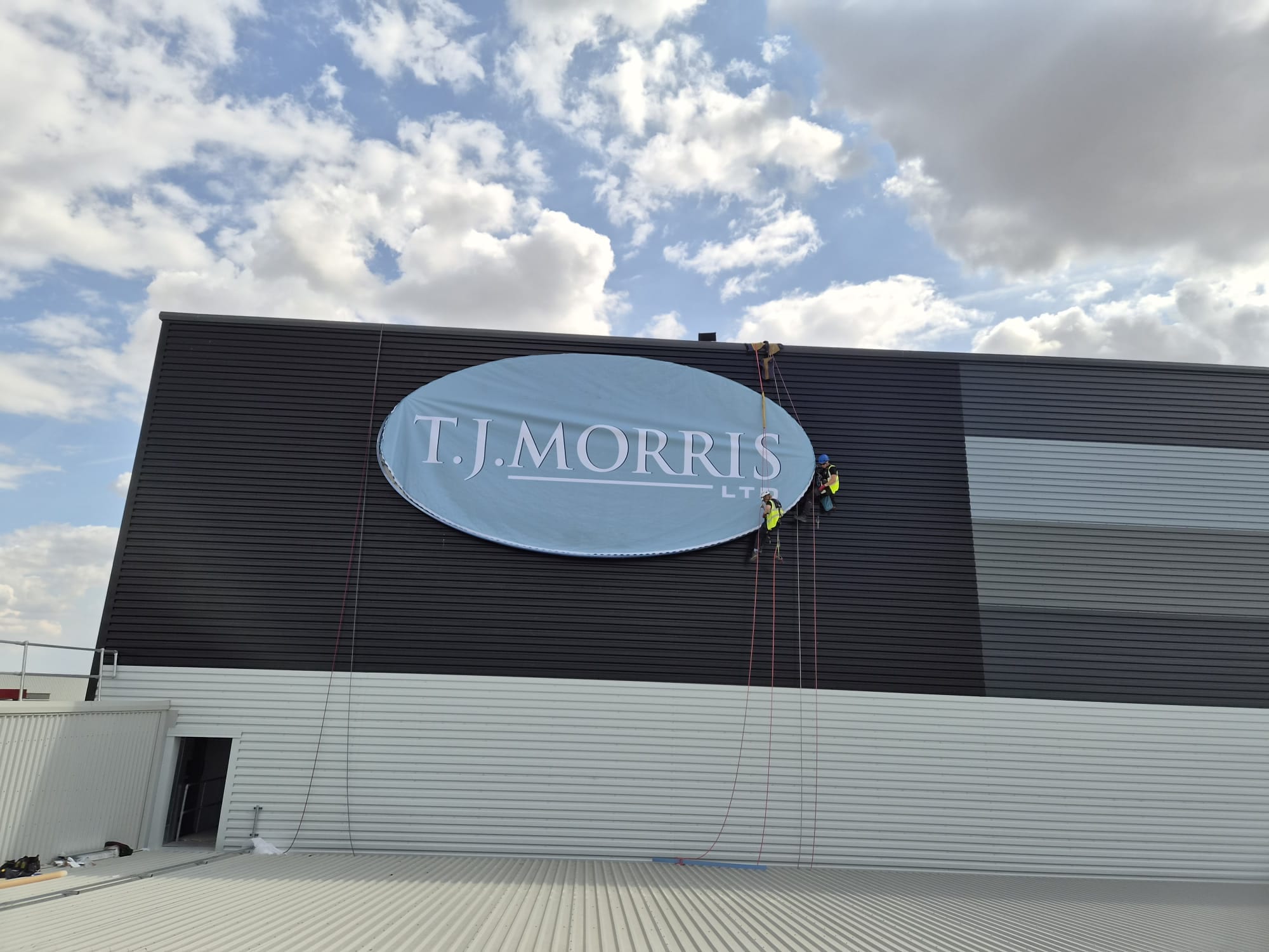 Home Bargains / TJ Morris Distribution Centre, Doncaster — installing tj morris circular sign