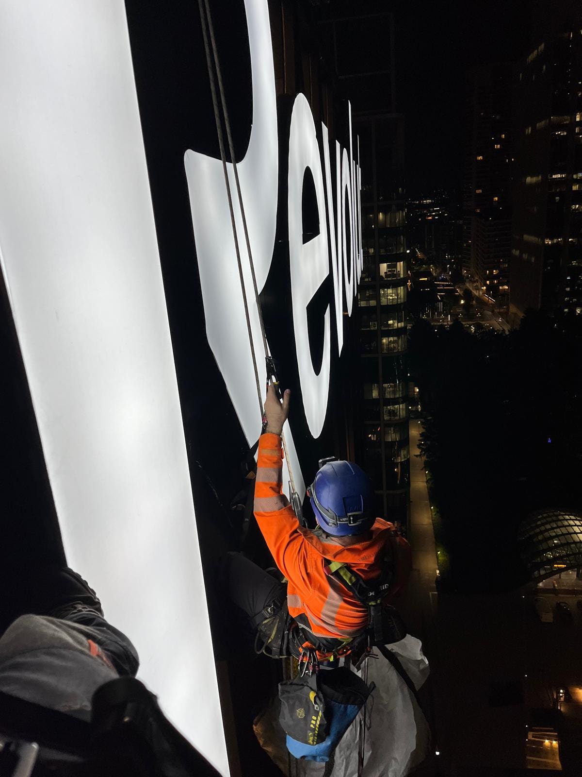 Revolut HQ, Canary Wharf — rope access lit letter face