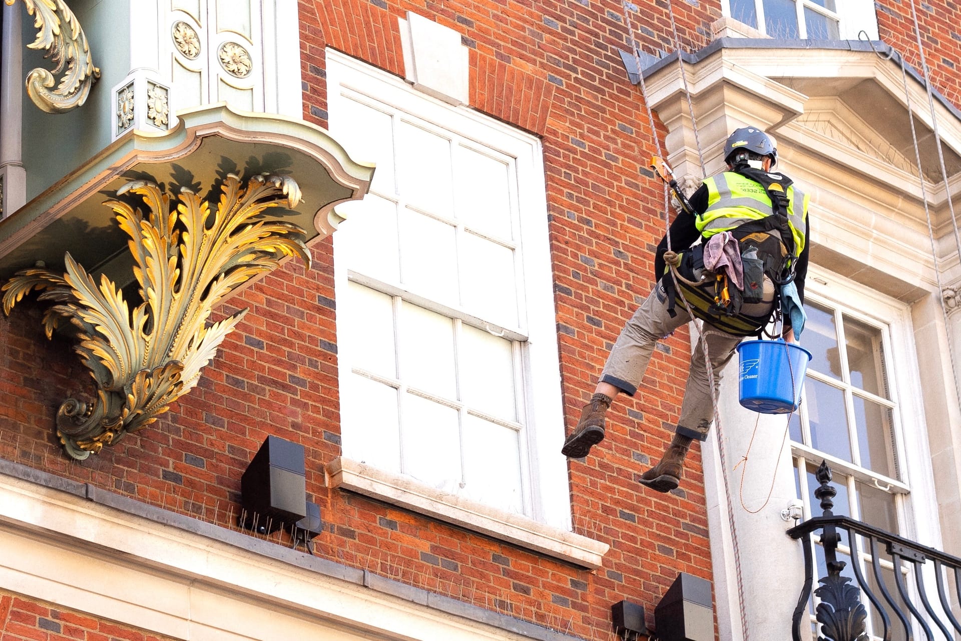 Rope Access cleaning works at height — heritage stone detail cleaning