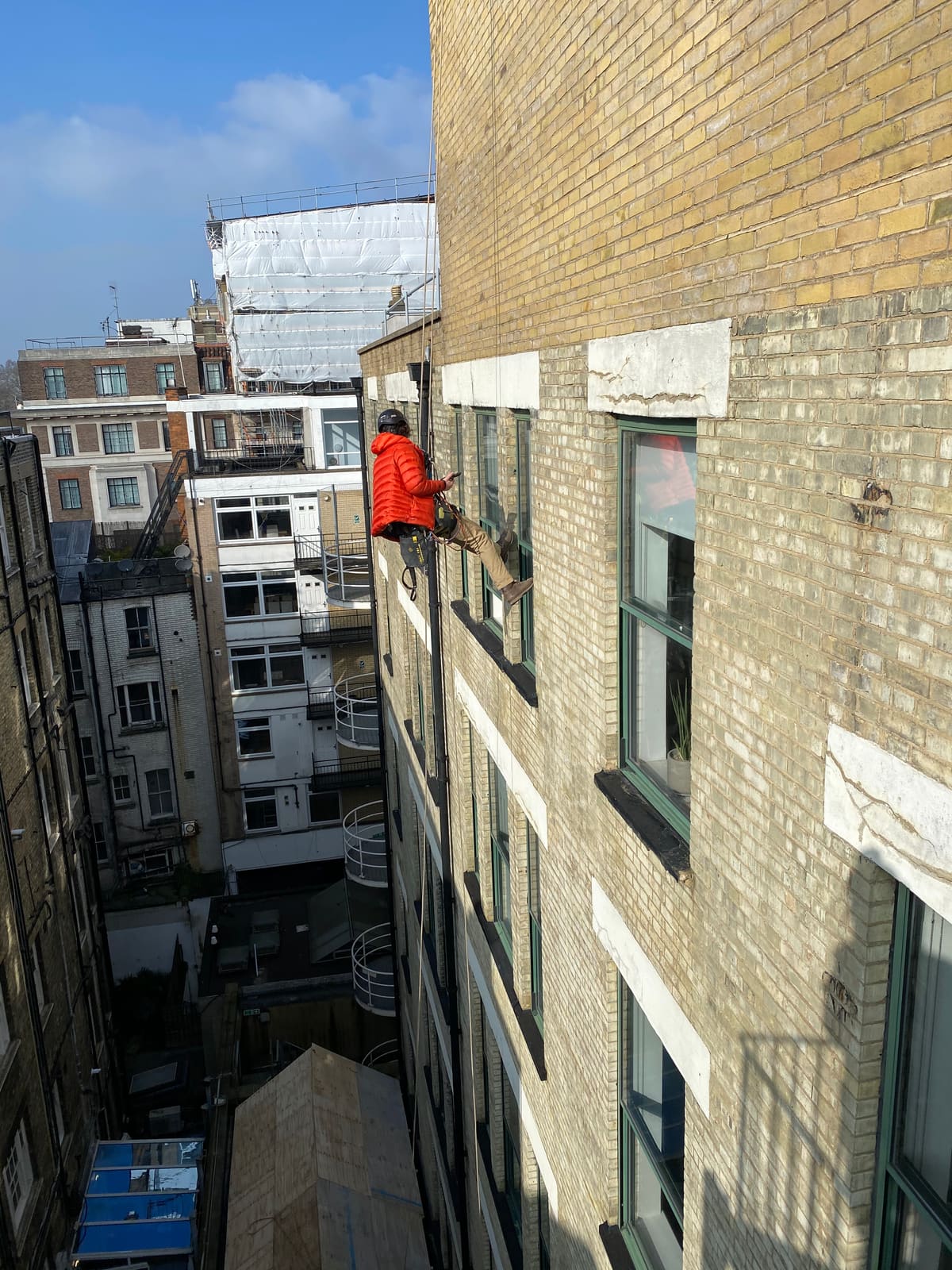 Rope Access construction works at height — courtyard facade
