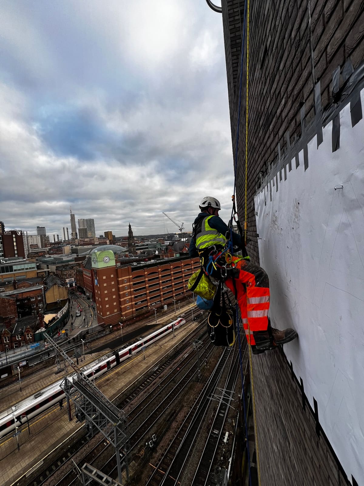 Rope Access signage & display works at height — railway side sign