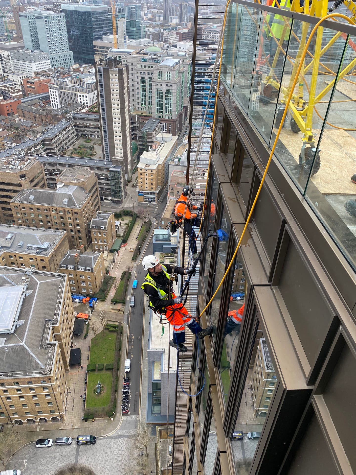 Rope Access window cleaning works at height — high rise curtain wall cleaning